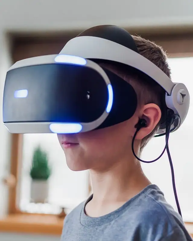 Little boy wearing VR headset - Artificial intelegence and Machine learning by Gosoft