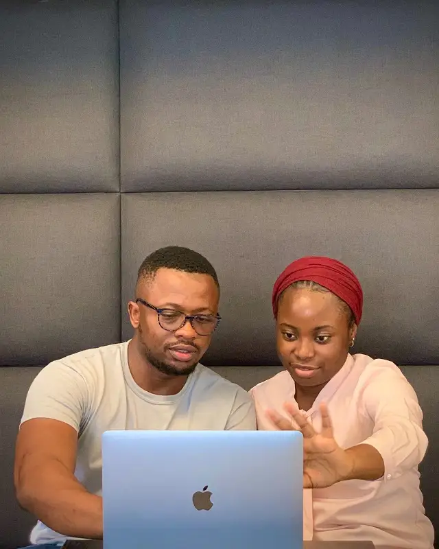 Man and women working together with laptop - SaaS development service at Gosoft